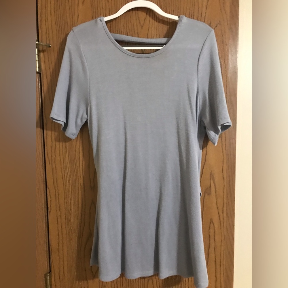 Long knit shirt with cross back. Beautiful light purple color. Very soft.